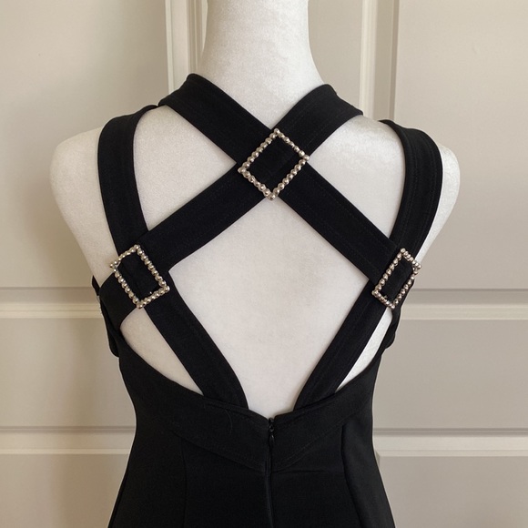 Black evening dress. Slit on left front. Strappy back with silver buckles. - Picture 3 of 8